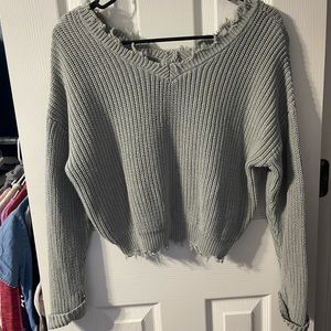 Shark bite hem sweater